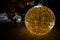 Illuminated ball of Christmas tree in the old harbor porto antico of Genoa, Italy.