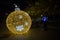 Illuminated ball of Christmas tree in the old harbor porto antico of Genoa, Italy.