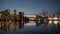 Illuminated BC Place and Vancouver skyline reflected in False Creek at night