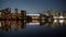 Illuminated BC Place and Vancouver skyline reflected in False Creek at night