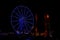 Illuminated Blue Ferris Wheel at Night