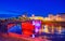 Illuminated bridge of Vilnius along Neris river, Lithuania