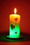 Illuminated candle with valentine decorations