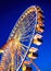 Illuminated carousel in the night sky.