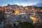 Illuminated city of ancient city of Matera, Southern Italy at twilight