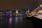 Illuminated Daugava promenade, Railroad Bridge and Vansu Bridge in Riga, Latvia