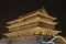 Illuminated Drum Tower at ancient city wall by night time, Xian, Shanxi Province, China