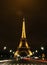 Illuminated Eiffel at night with light trails