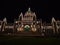 Illuminated entrance of British Columbia Parliament Buildings in neo-baroque style with lights on facade in Victoria, Canada.