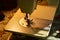 Illuminated fabric table, sewing machine foot and needle