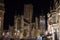 Illuminated facade of Saint Nicholas` Church Sint-Niklaaskerk with the clock tower of Belfry of Ghent Het Belfort at the