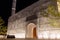 Illuminated facade of white Mosque of Light in Dubai.