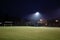 Illuminated football field in the night