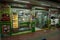 Illuminated front of a bakery at night demonstrating breads, cookies and desserts, Guatape, Columbia