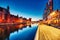 Illuminated Gdansk Old Town with Calm Motlawa River at Dusk, Poland