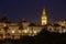 The illuminated Giralda tower in downtown Seville during the blue hour