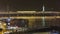 Illuminated Golden Horn Metro Bridge, blurred lines of busy traffic in Istanbul