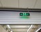 Illuminated green exit sign or fire escape sign.
