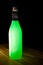 Illuminated green glass drink bottle. Art and craft recycling pr