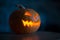 Illuminated halloween pumpkin on black background