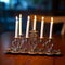 Illuminated Hanukkah Menorah on Dark Wooden Table