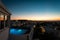 Illuminated hotel pool on Mykonos after sunset