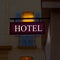 Illuminated hotel purple sign