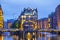 Illuminated house and two brides in Speicherstadt, Hamburg