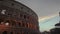 Illuminated from inside Colosseum in Rome center at sunset