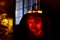 Illuminated jack o` lantern carved with the design of a child`s face