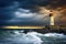 illuminated lighthouse during a stormy night