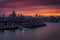 The illuminated london skyline during a fiery summer sunset