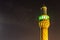 Illuminated minaret of Iranian Mosque Imam Hussein Mosque in Dubai.