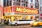 Illuminated neon sign of burger chain Mc Donalds on 42nd Street in Manhattan