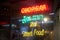 Illuminated neon sign of a Thai cuisine street food restaurant in Kowloon City, Hong Kong at night