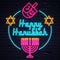 Illuminated neon signs Happy Hanukkah holiday light electric banner glowing on black brickwall.