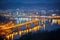 illuminated night cityscape featuring bridges