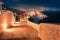 Illuminated night scene of Santorini island. Amazing spring scene of famous Greek resort Thira, Greece