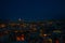 Illuminated at night streets of Goreme, Turkey, Cappadocia. The famous center of flight balloons. On the horizon - highlighted