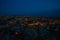 Illuminated at night streets of Goreme, Turkey, Cappadocia. The famous center of flight balloons. On the horizon - highlighted