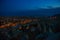 Illuminated at night streets of Goreme, Turkey, Cappadocia. The famous center of flight balloons. On the horizon - highlighted