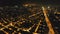 Illuminated night streets at Manila city aerial. Modern buildings, skyscrapers, highway at cityscape