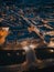 Illuminated nighttime aerial view of a bustling metropolitan cityscape of Bath, UK