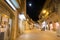 Illuminated nocturnal view street with monument