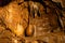 Illuminated picturesque karst rock formations in Balcarka Cave, Moravian Karst, Czech: Moravsky Kras, Czech Republic