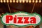 Illuminated pizza shop sign. Letters with In jeder Geschmacksrichtung Means In every flavor