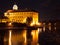 Illuminated Podebrady Castle at Labe River by night, Czech Republic