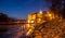 Illuminated Podebrady Castle at Labe River by night, Czech Republic