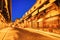 Illuminated Ponte Vecchio Bridge with Reflection in Arno River at Dusk, Florence