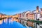 Illuminated Ponte Vecchio Bridge with Reflection in Arno River at Dusk, Florence